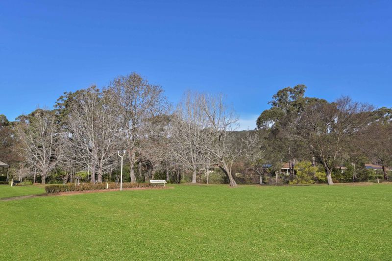 Sit back and relax on your patio! Looking onto the parkland enjoying the lifestyle here at Tarragal Glen!
