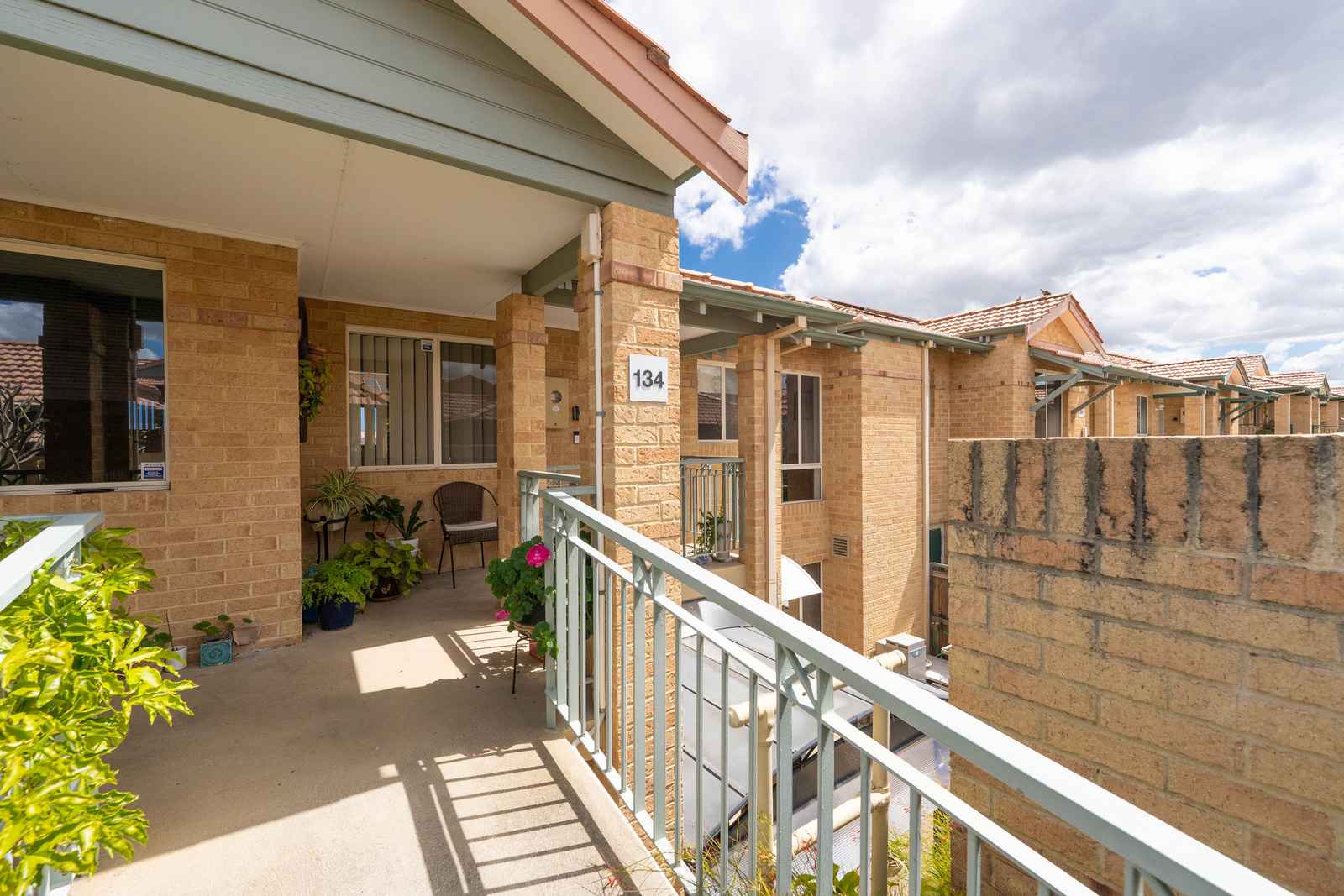 Move-in ready upper villa with sunny west-facing balcony