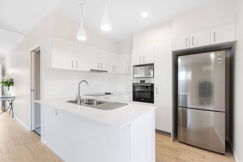 Practically new! Stones throw to community facilities!