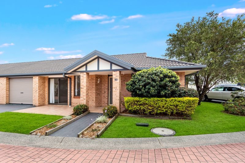 2 bedroom, 1.5 bathroom villa with pet friendly rear yard.