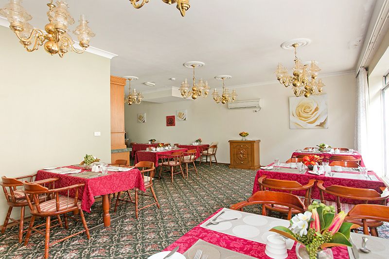 Sunny ground floor serviced apartment with garden and pool views.