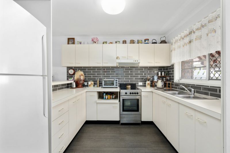 Beautiful two-bedroom, one bathroom villa with covered rear entertaining area.