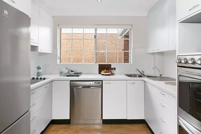 Perfectly located unit overlooking lush, green gardens.