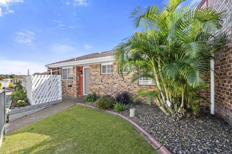 Beautiful two-bedroom, one bathroom villa with covered rear entertaining area.