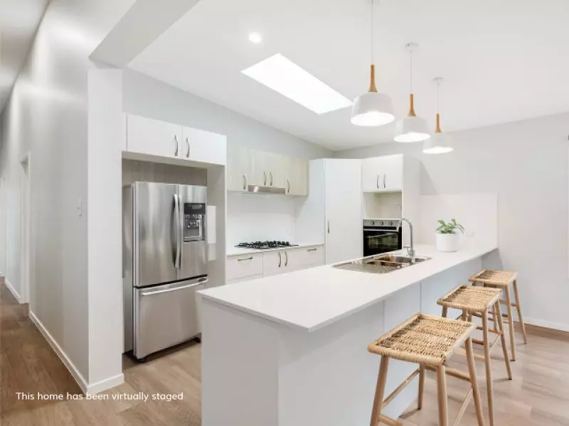 Opposite green space, on a corner lot