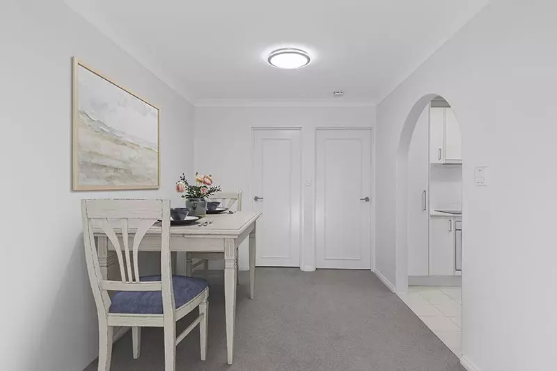 Immaculately maintained upper-level unit with district views and easy access ramp.