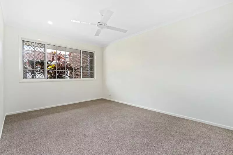 Beautiful two-bedroom, one bathroom villa with covered rear entertaining area.