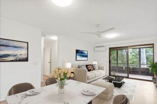 Charming two-bedroom apartment surrounded by lush greenery