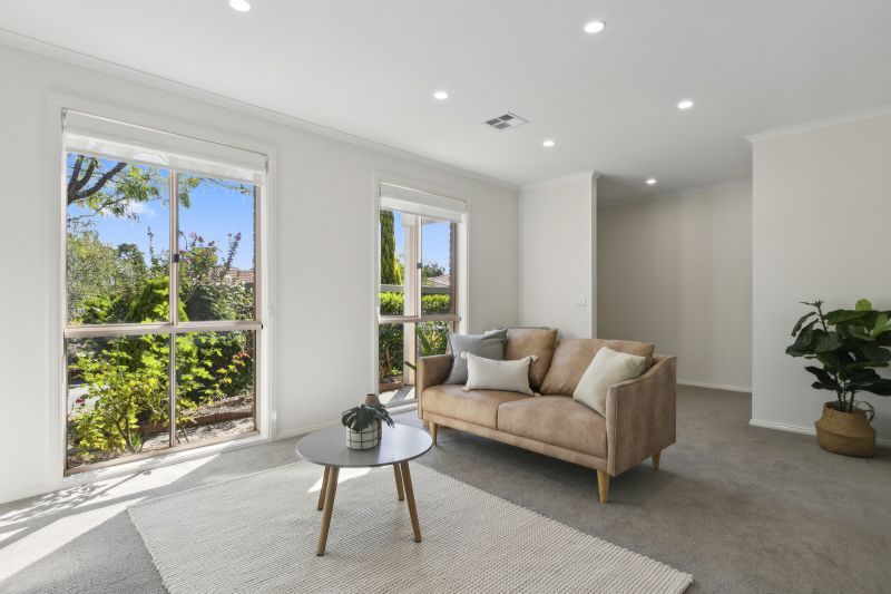 Exclusive three-bedroom villa featuring a pristine backyard