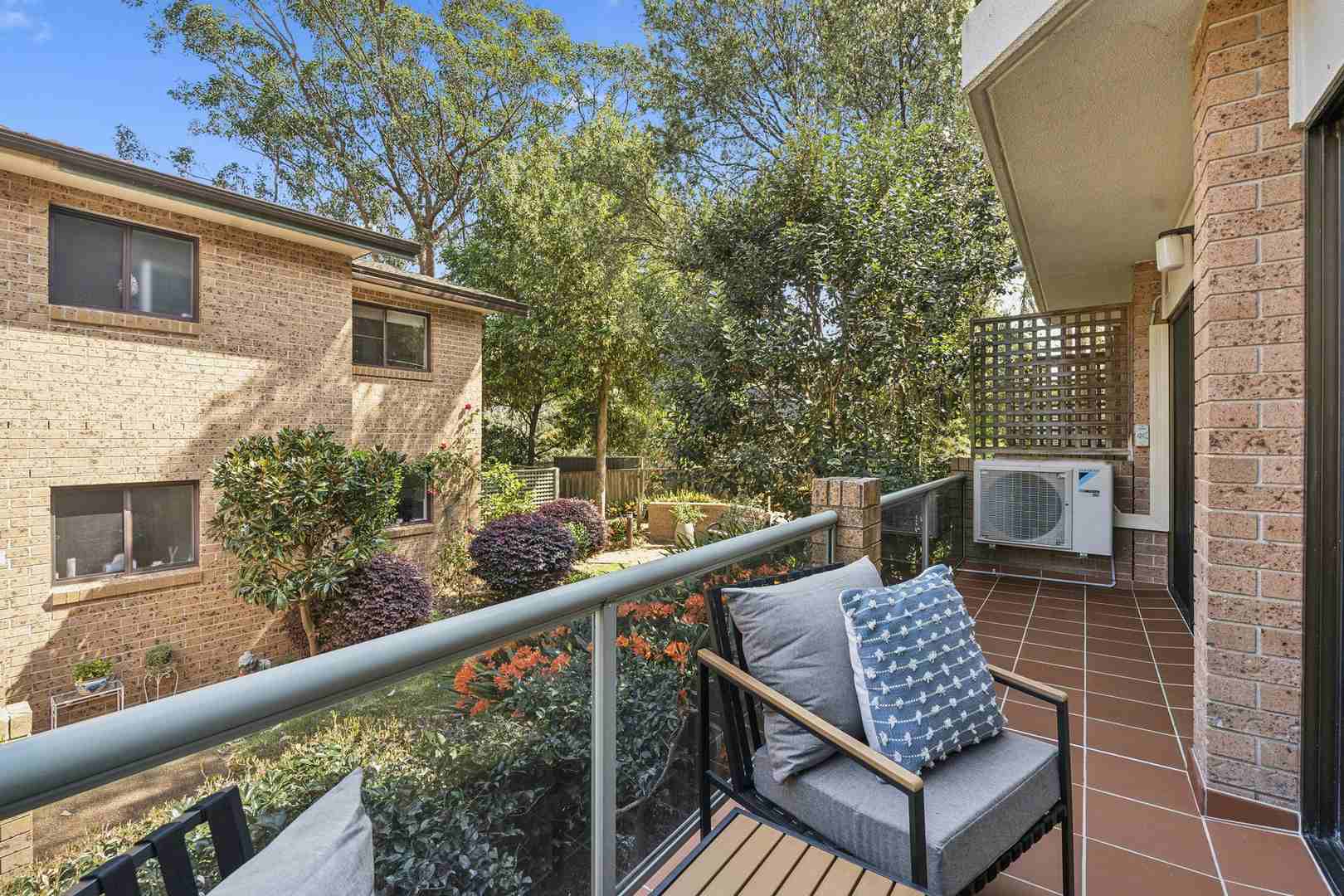 A serviced apartment surrounded by garden greenery