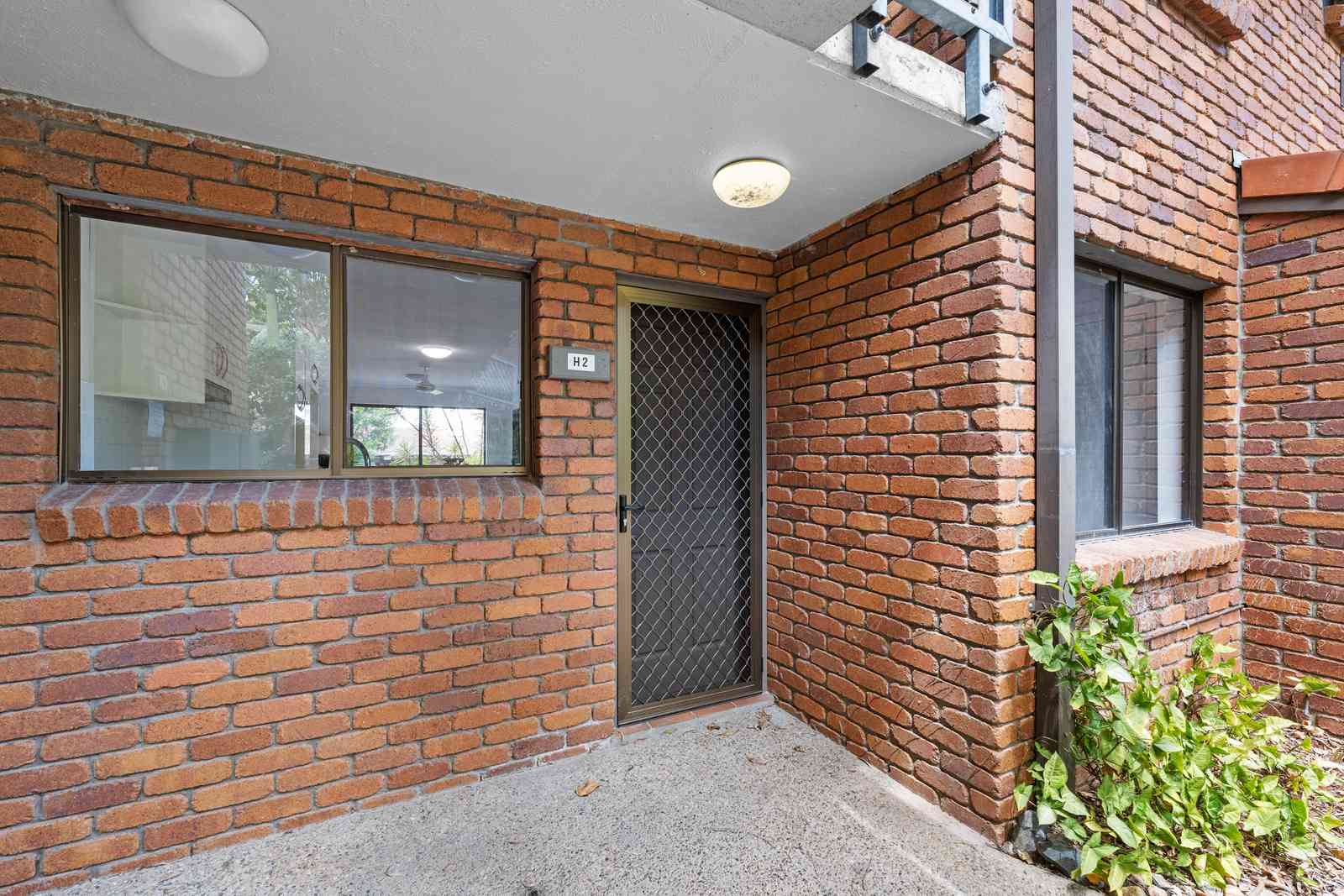 Charming one-bedroom plus study apartment surrounded by lush greenery