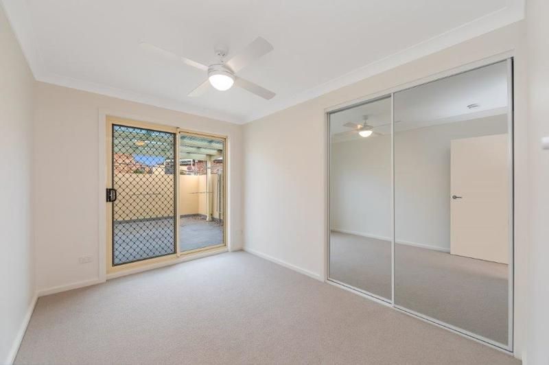 Modern, Spacious Living with Large Sunny Courtyard and Single Garage