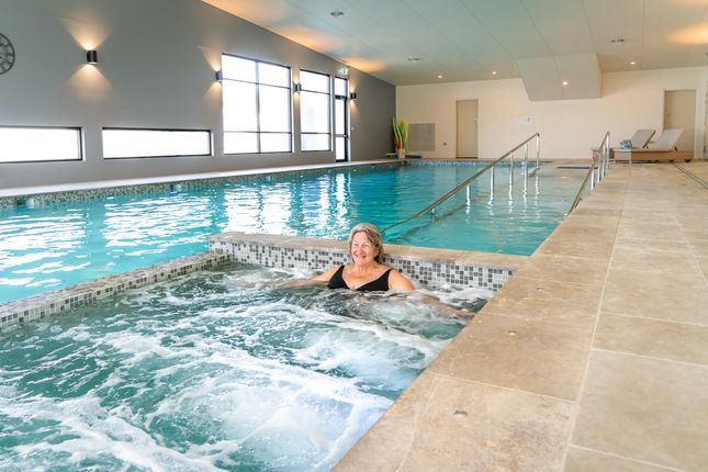 A resident of the Tallowood land lease community at Port Stephens hanging in the spa