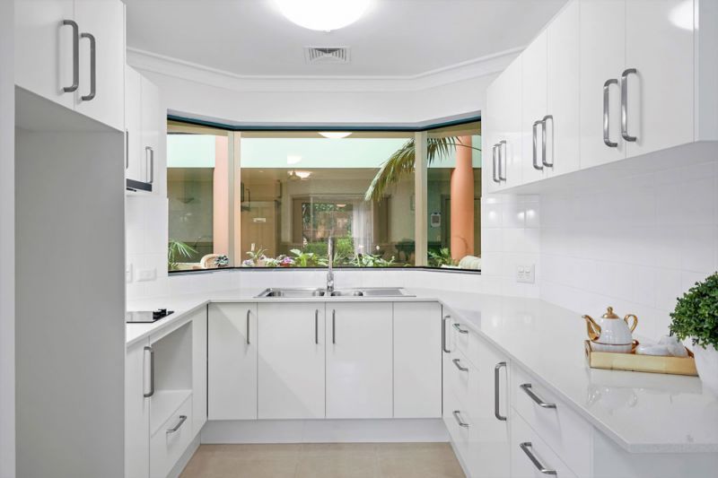 Ground floor apartment with enclosed balcony