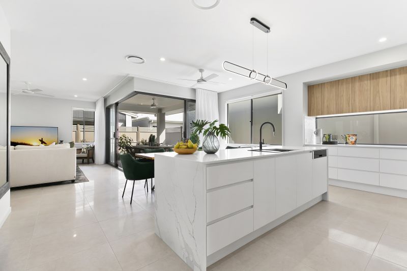 STUNNING DISPLAY HOME FACING TRANQUIL LAKE