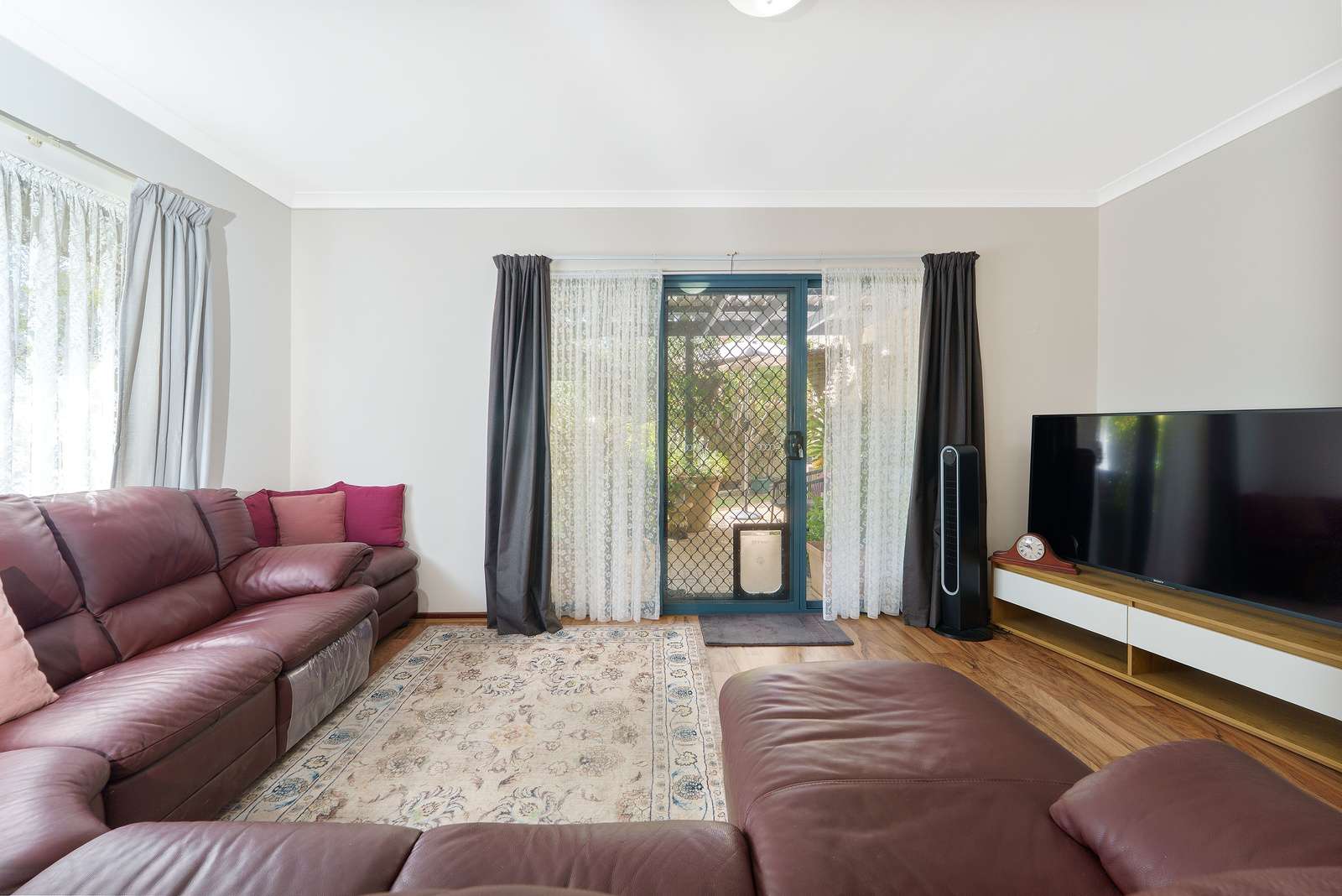 Light-filled corner home with garden views & north-facing courtyard