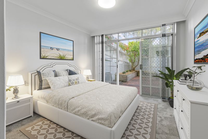 Centrally located, renovated ground floor unit surrounded by lush gardens with large courtyard.