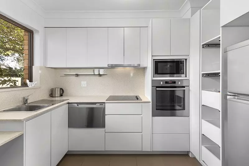 Beautifully presented two bedroom unit nestled in the centre of the village with large rear courtyard.