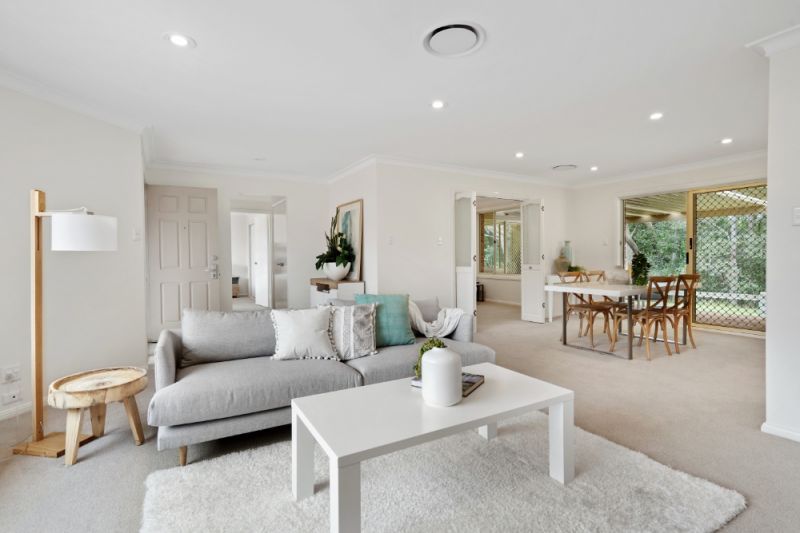 Sit back and relax on your sun drenched patio! Looking onto the parkland enjoying the lifestyle here at Tarragal Glen!