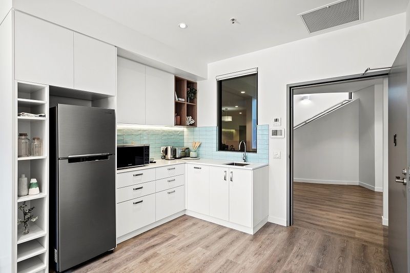Rare upper level apartment with stunning Northern views over the bowling green.