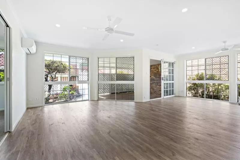 Beautiful two-bedroom, one bathroom villa with covered rear entertaining area.