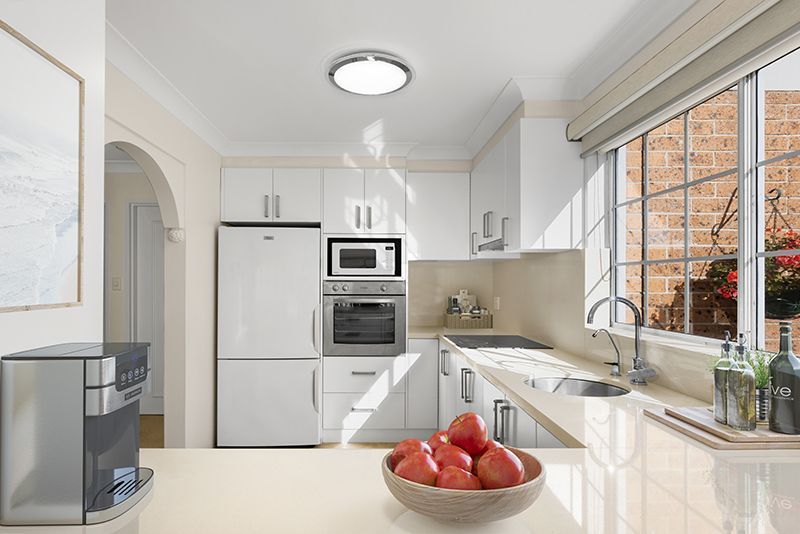 Centrally located, impeccably presented ground floor unit with large rear sunny garden courtyard.