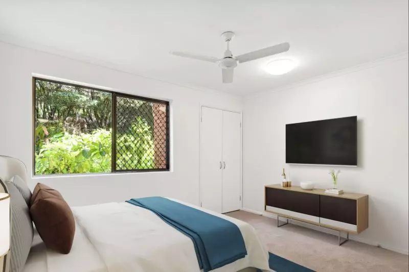 Charming two-bedroom apartment surrounded by lush greenery