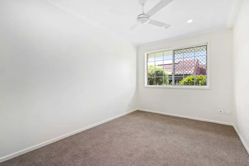 Beautiful two-bedroom, one bathroom villa with covered rear entertaining area.