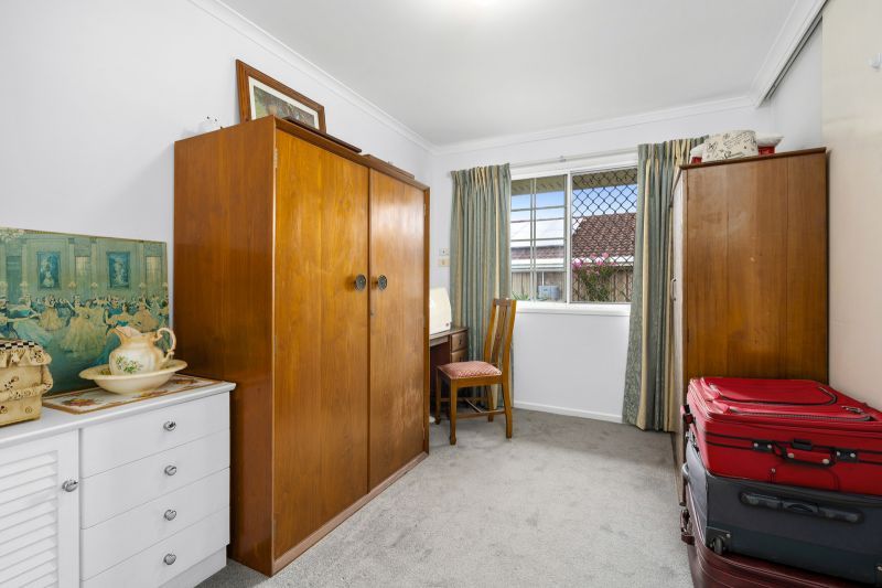 Beautiful two-bedroom, one bathroom villa with covered rear entertaining area.