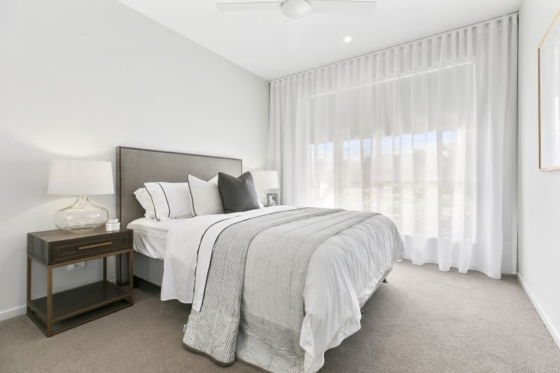 STUNNING DISPLAY HOME FACING TRANQUIL LAKE