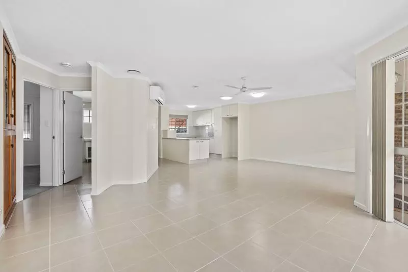 Beautiful two-bedroom, one bathroom villa with covered rear entertaining area.