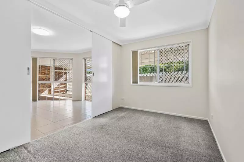 Beautiful two-bedroom, one bathroom villa with covered rear entertaining area.