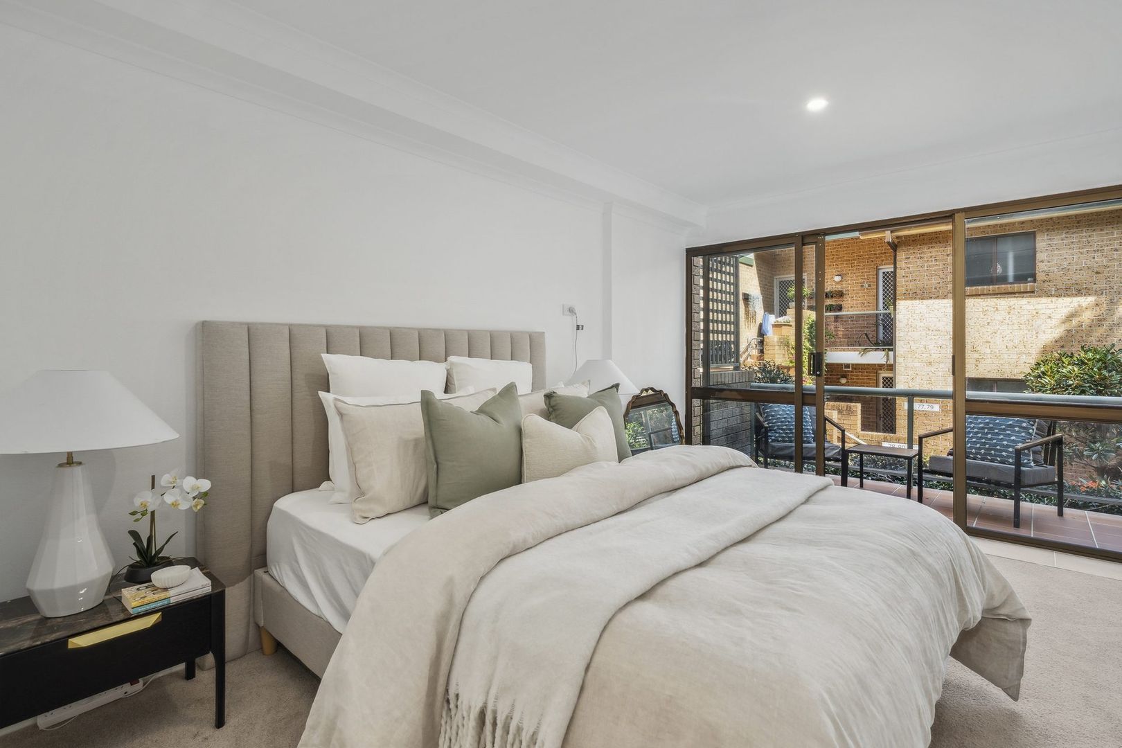A serviced apartment surrounded by garden greenery