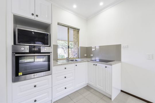 Enjoy easy living steps from village amenities
