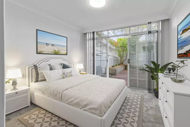 Centrally located, renovated ground floor unit surrounded by lush gardens with large courtyard.