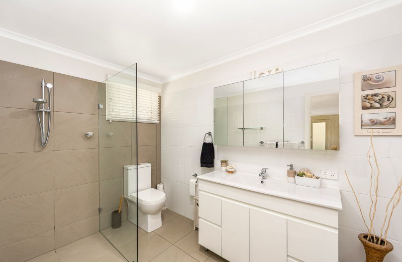 Coastal Gem! Stylish Updates & Serene Green Space