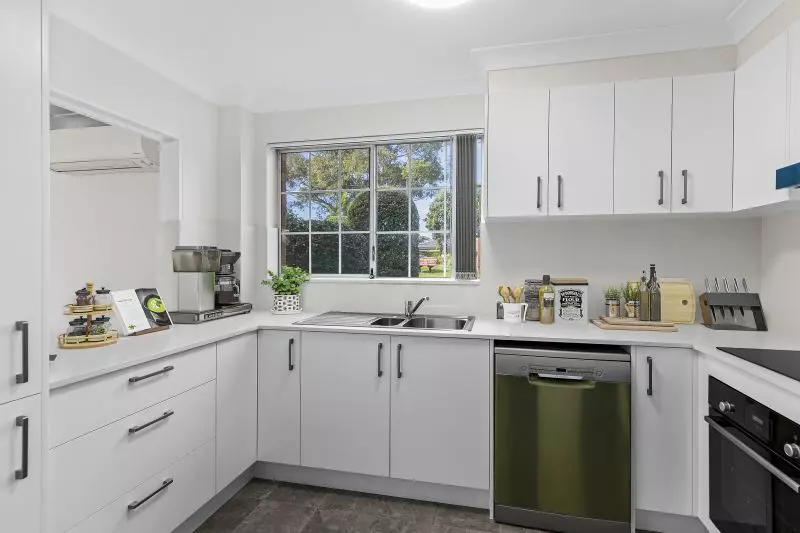 Centrally located, renovated ground floor unit surrounded by lush gardens with large courtyard.