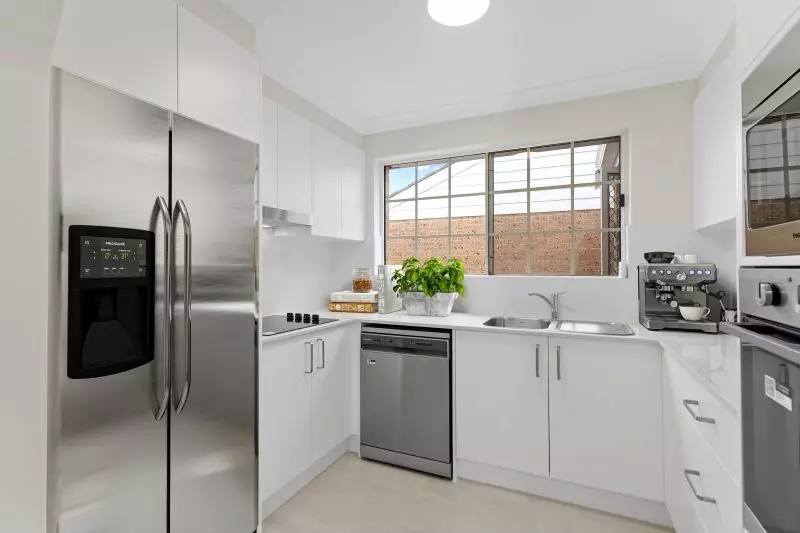 An elegant, fully renovated one-bedroom unit overlooking gardens.