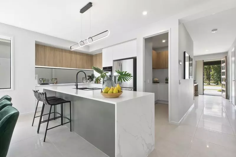 STUNNING DISPLAY HOME FACING TRANQUIL LAKE