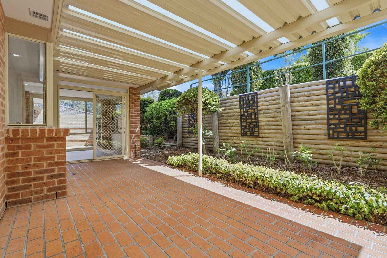 East facing rear aspect with enclosed sunroom and patio area for entertaining