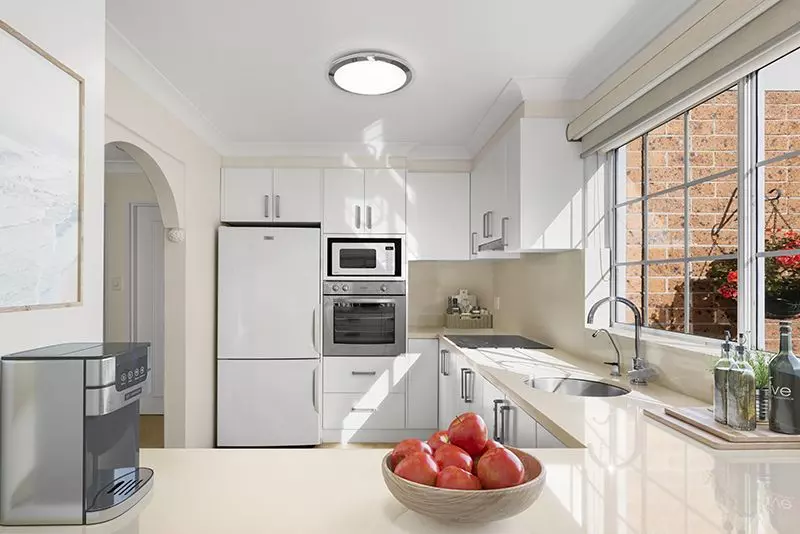 Centrally located, impeccably presented ground floor unit with large rear sunny garden courtyard.