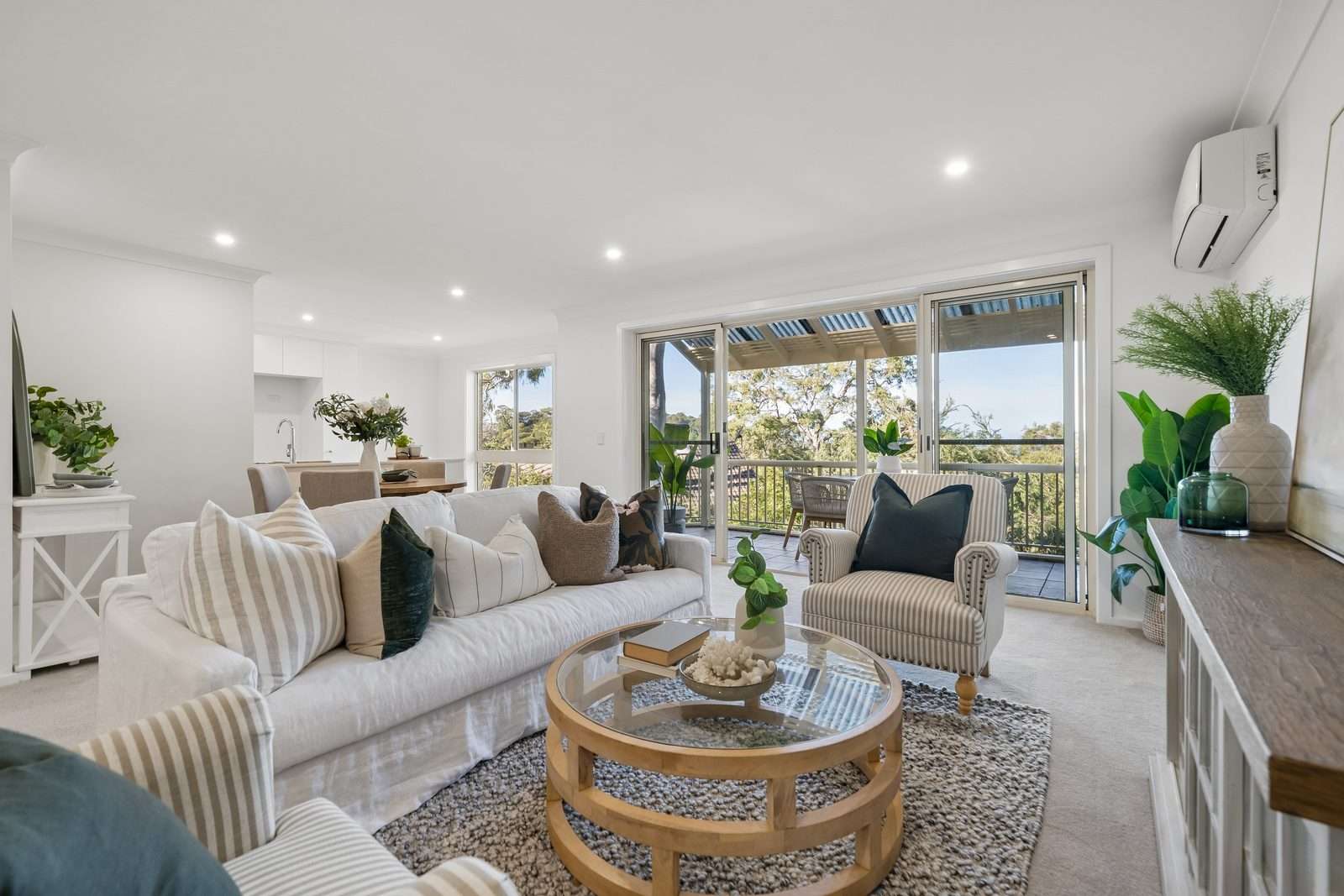 Turn-Key Two-Bedroom Living with Treetop and Water Glimpses