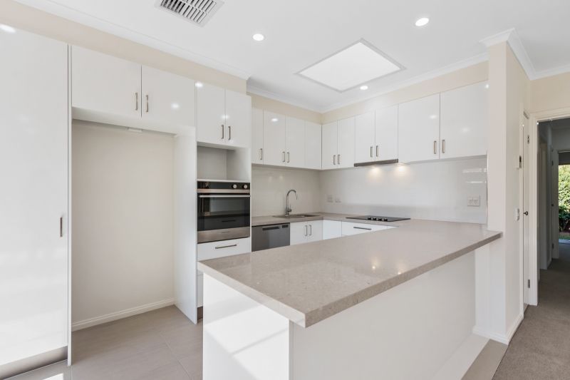 Lovely 2-bedroom villa with paved private courtyard and landscaped gardens