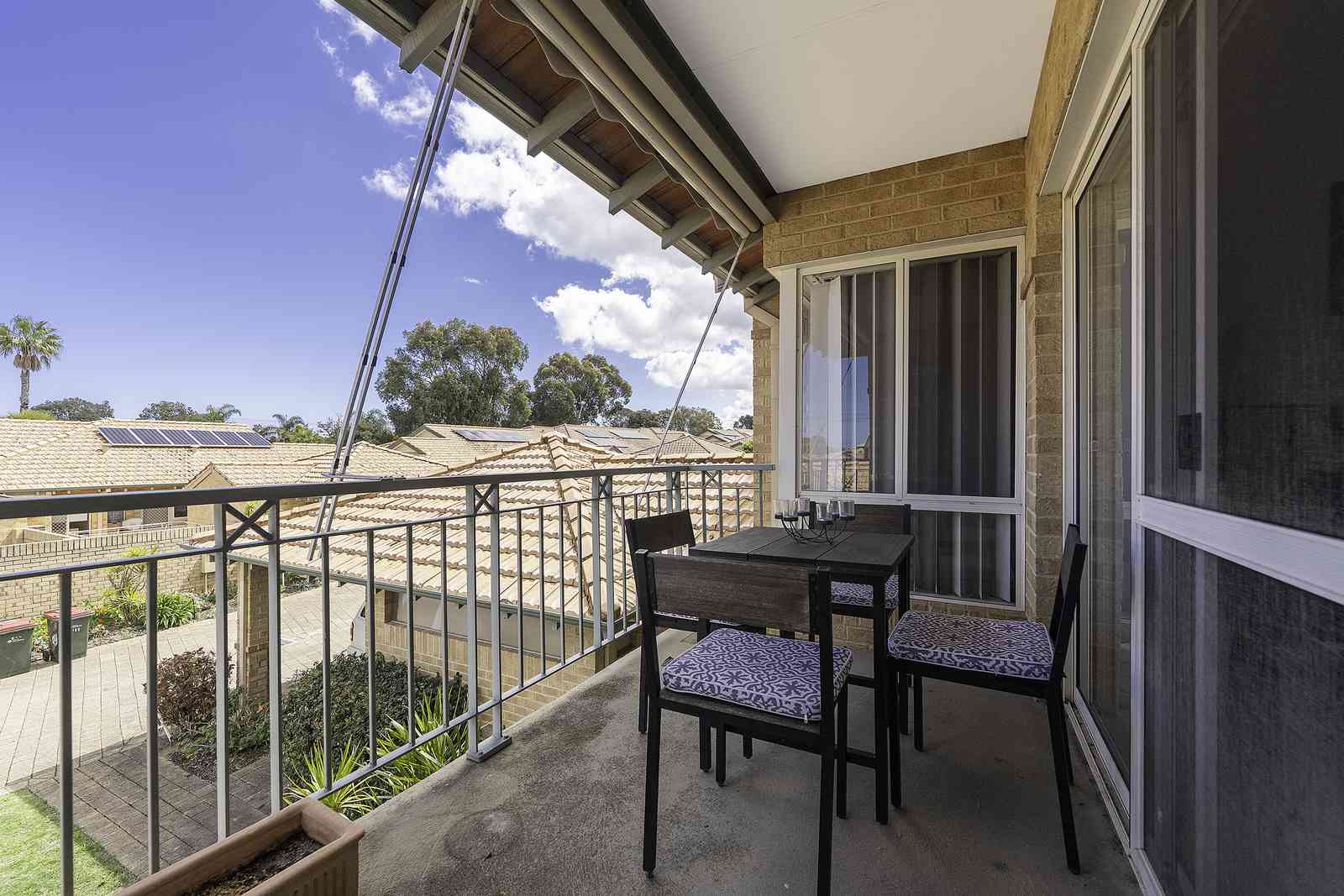 Move-in ready upper villa with sunny west-facing balcony