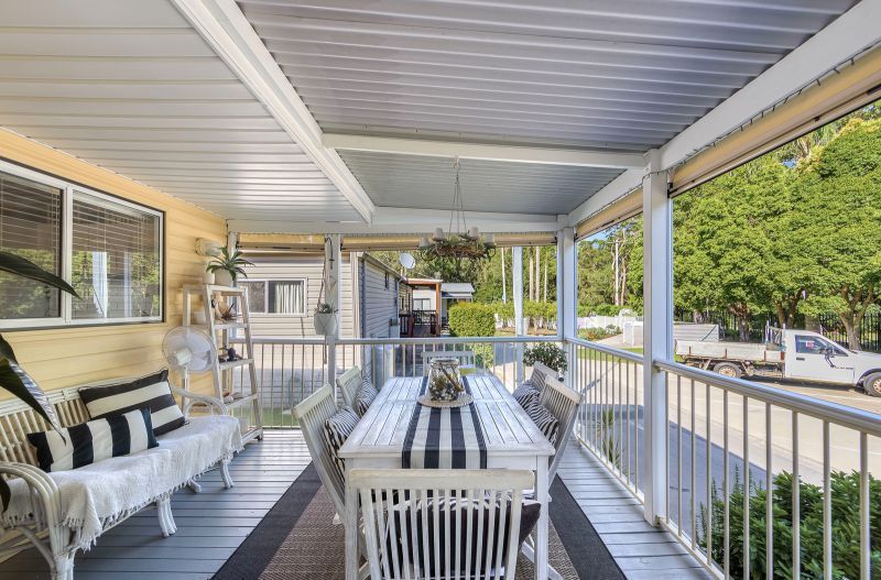 Coastal Gem! Stylish Updates & Serene Green Space