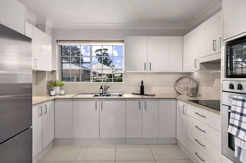 Exquisitely  renovated corner ground floor unit close to the clubhouse