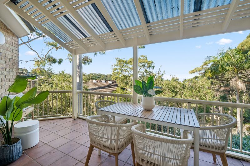 Turn-Key Two-Bedroom Living with Treetop and Water Glimpses