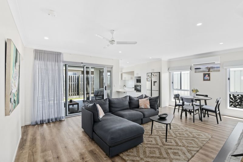 Elevated Home with Spacious Backyard and Modern Interior