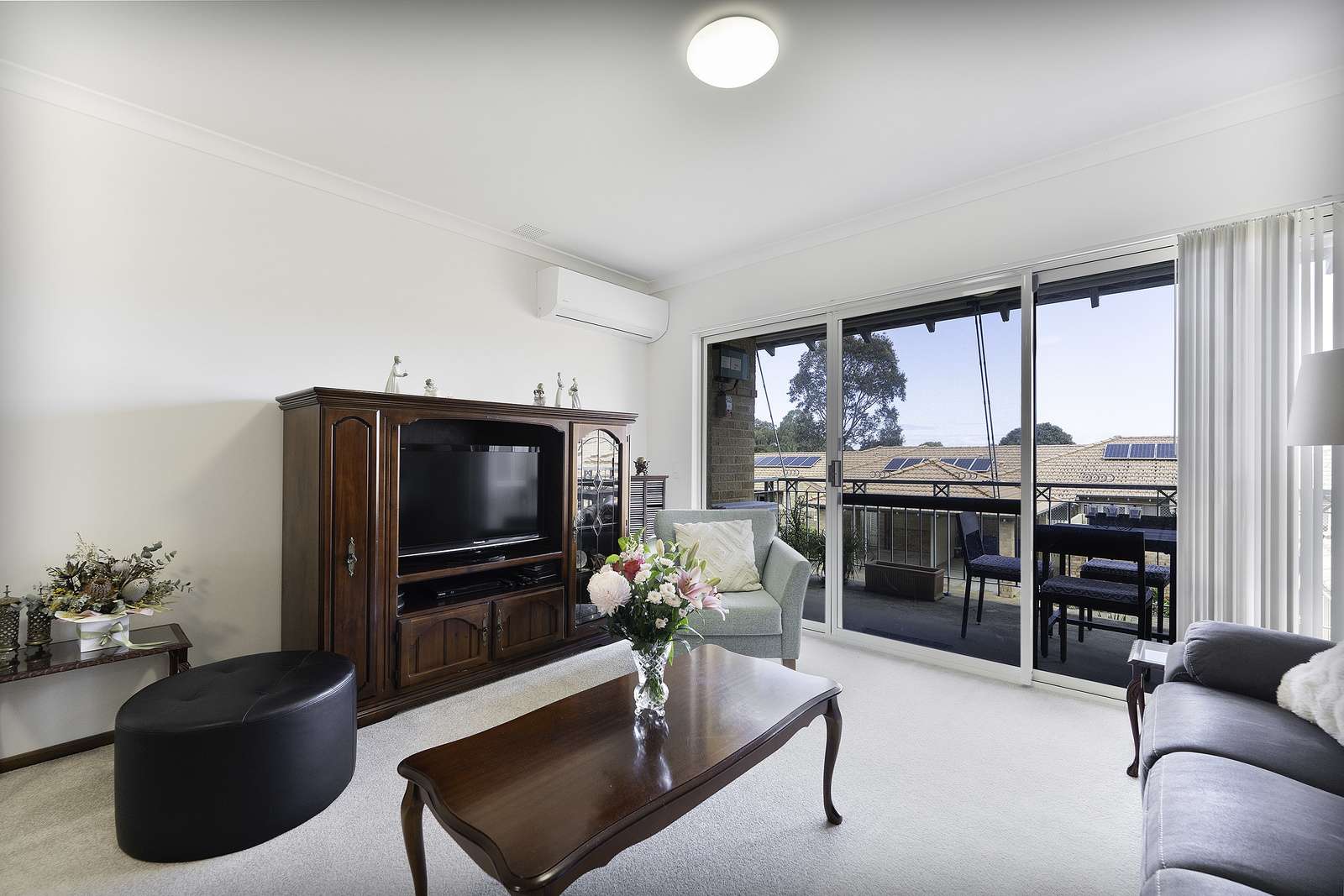 Move-in ready upper villa with sunny west-facing balcony