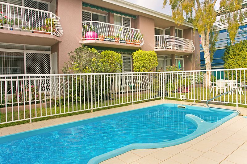 Sunny ground floor serviced apartment with garden and pool views.